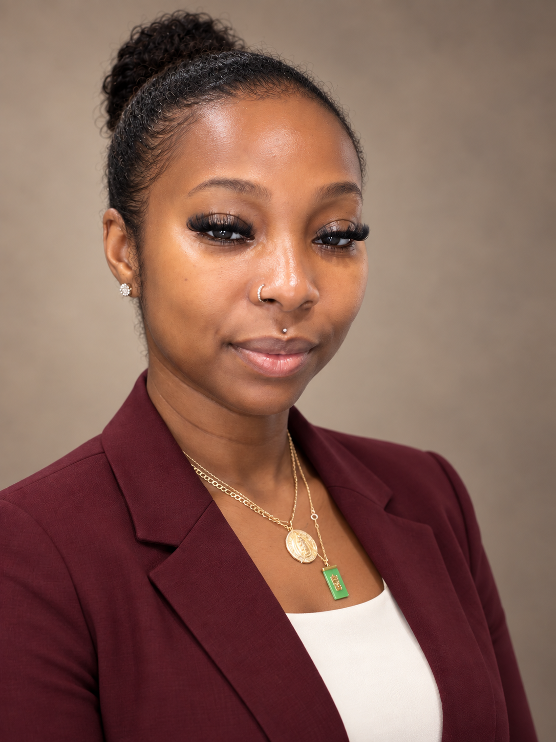 Tania Greenwood, founder of Angel-Faith Beauty & Wellness, in a burgundy blazer
